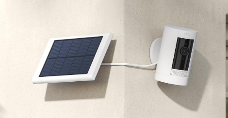Solar-powered wireless outdoor security camera mounted on exterior wall for residential surveillance by American Security Force