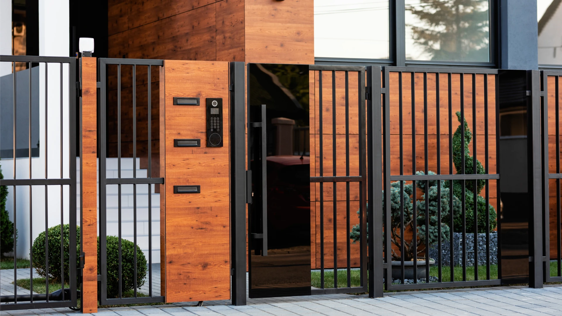Modern residential gated community entrance with secure metal access gate illustrating gated community security measures.