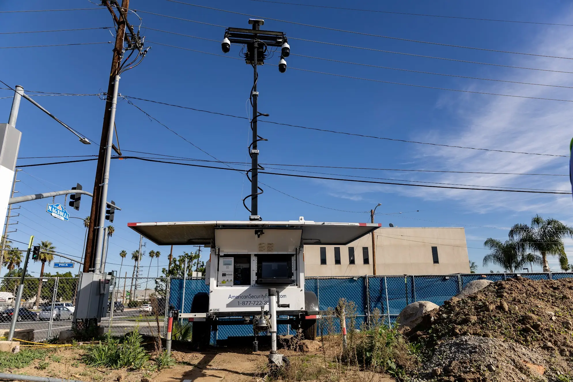 Mobile surveillance trailer with mounted security cameras monitoring a construction site intersection by American Security Force