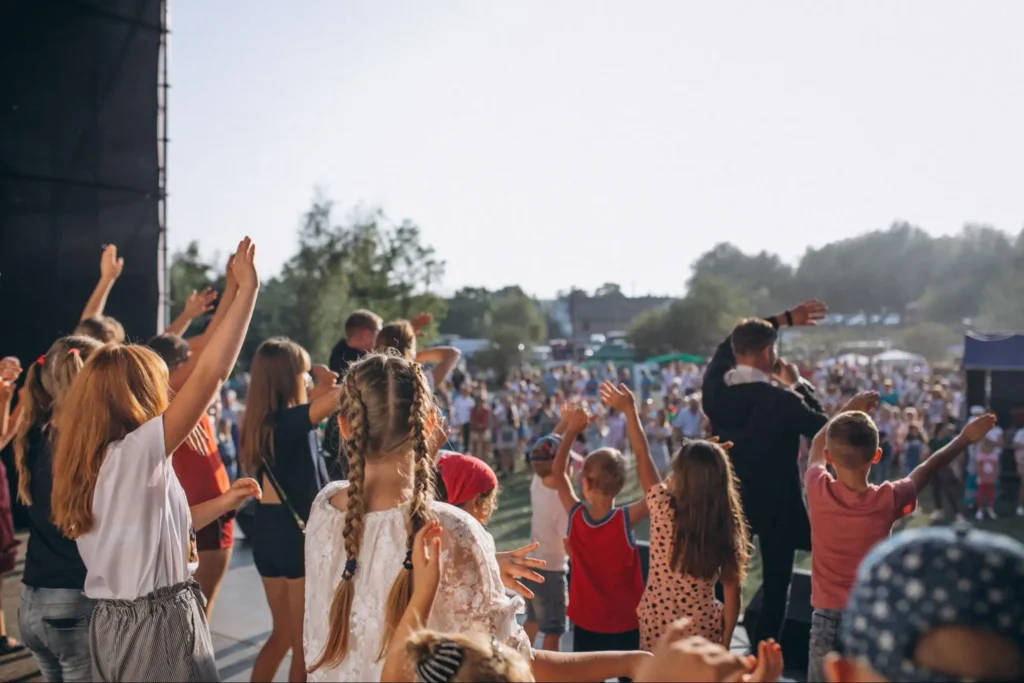 Children and families enjoying an outdoor event with crowd safety supported by American Security Force event security services