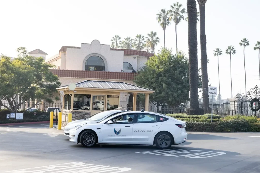 American Security Force patrol vehicle providing residential security services at a gated community entrance