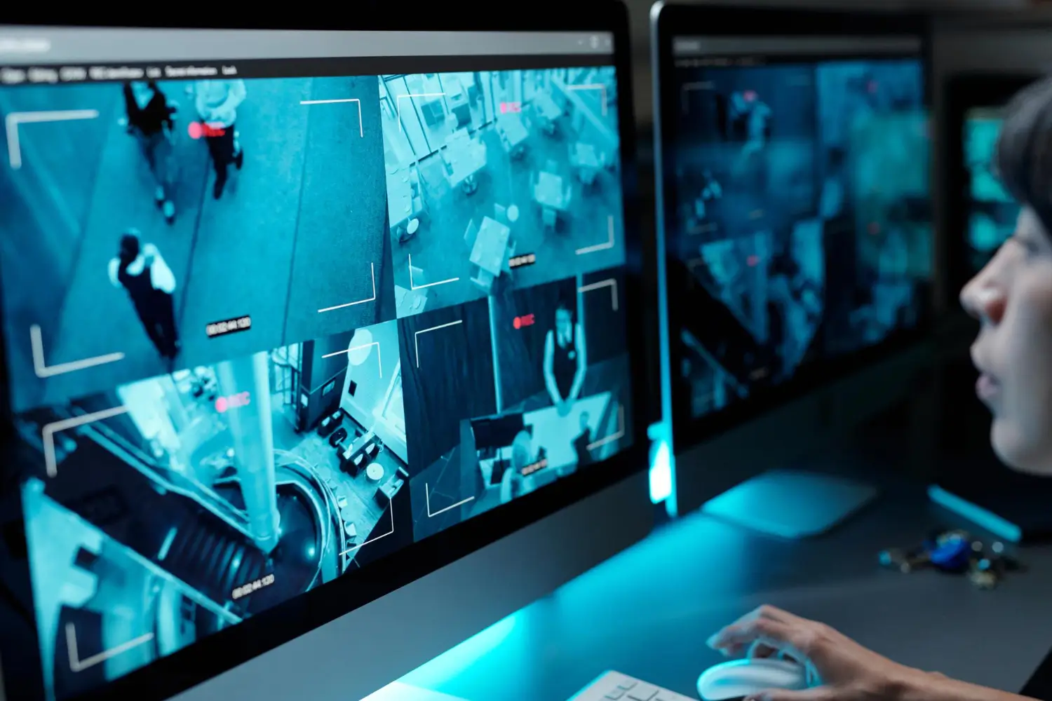 Wall of CCTV video screens displaying live surveillance footage, representing the advanced technology used to support security guards for events by American Security Force.